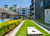 Thumbnail 13 of 49 - a backyard with a hot tub and grassy area