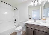 Thumbnail 37 of 63 - a bathroom with a sink toilet and a bath tub