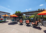 Thumbnail 56 of 63 - a patio with chairs and umbrellas