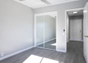 Thumbnail 24 of 30 - A room with a white door and a white mat on the floor.