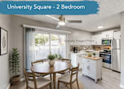 Thumbnail 31 of 32 - A kitchen with a table and chairs in a room with a ceiling fan.