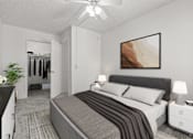 Thumbnail 3 of 18 - A bedroom with a bed, nightstands, and a ceiling fan.