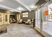 Thumbnail 29 of 32 - A room with a carpeted floor and a glass door.