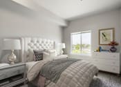 Thumbnail 12 of 32 - A bedroom with a large bed, a nightstand with a lamp, and a window with a view of trees outside.