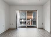 Thumbnail 8 of 12 - A room with a sliding glass door leading to a balcony at Pin Yuen, Sacramento, CA