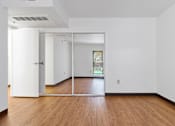 Thumbnail 7 of 12 - A room with white walls and wooden flooring with a sliding glass door at Pin Yuen, Sacramento, CA