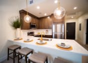 Thumbnail 6 of 28 - a kitchen with a counter top and a sink