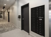 Thumbnail 12 of 28 - a view of the elevators in the hallway of a building with a locker room
