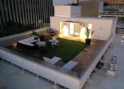 Thumbnail 16 of 28 - a roof terrace with a lawn on top of a building