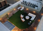 Thumbnail 17 of 28 - a roof top view of a living area with furniture and grass