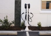 Thumbnail 22 of 28 - a pair of parking meters are plugged into the side of a building