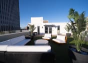 Thumbnail 23 of 28 - a roof terrace with couches and chairs and potted plants