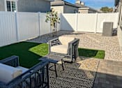 Thumbnail 29 of 31 - a small backyard with a seating area and artificial grass at Zora Encanto, Phoenix, AZ