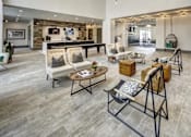 Thumbnail 9 of 40 - A spacious lobby with a variety of seating options and a bar area at Arise Riverside Apartments, Texas 78741