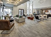 Thumbnail 3 of 40 - A modern living room with a wooden floor and a fireplace at Arise Riverside Apartments, Austin, 78741