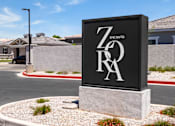 Thumbnail 31 of 31 - a sign in front of a road with a house in the background at Zora Encanto, Phoenix, Arizona