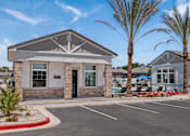 Thumbnail 3 of 31 - the front of a building with palm trees and a parking lot at Zora Encanto, Arizona