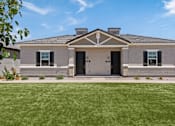 Thumbnail 12 of 31 - a house with a lawn in front of it at Zora Encanto, Phoenix