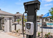 Thumbnail 30 of 31 - a parking meter in front of a fence and a pool at Zora Encanto, Phoenix, 85035
