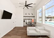 Thumbnail 28 of 31 - a living room with two couches and a table and a ceiling fan at Zora Encanto, Phoenix, AZ