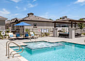 Thumbnail 7 of 31 - our apartments have a resort style pool with lounge chairs and umbrellas at Zora Encanto, Arizona