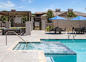 Thumbnail 8 of 31 - our resort style swimming pool with umbrellas and chairs at our apartments at Zora Encanto, Phoenix, 85035