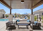 Thumbnail 10 of 31 - a resort style pool with lounge chairs and umbrellas at Zora Encanto, Arizona 85035