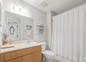 Thumbnail 31 of 35 - a bathroom with a shower and a toilet and a sink
