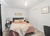 Thumbnail 2 of 26 - a bedroom with a bed and a closet