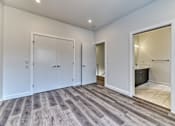 Thumbnail 34 of 73 - A room with a grey floor and white walls.