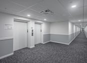 Thumbnail 29 of 31 - Long Hallway And Elevator Access at The Pointe at Riverview, Alberta, T6M 3H4