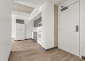 Thumbnail 14 of 35 - A kitchen with white appliances and wooden floors.