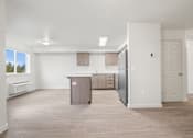 Thumbnail 10 of 13 - A kitchen area with a refrigerator, cabinets, and a countertop.