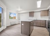 Thumbnail 9 of 13 - A kitchen with wooden cabinets and a refrigerator.