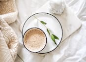 Thumbnail 8 of 15 - a cup of coffee with a flower on a plate