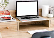 Thumbnail 2 of 15 - a desk with a laptop with a white screen