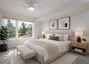Thumbnail 11 of 38 - A bedroom with a large bed, a potted plant, and two framed pictures on the wall.
