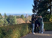 Thumbnail 6 of 10 - A group of people taking a selfie in a park.