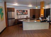 Thumbnail 12 of 25 - a large kitchen with a center island and stainless steel appliances