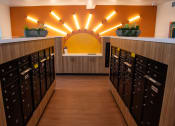 Thumbnail 14 of 25 - a card room with a bunch of mailboxes and a yellow light on the wall