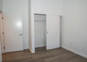 Thumbnail 3 of 25 - an empty room with white walls and a closet