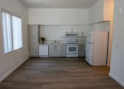 Thumbnail 1 of 25 - an empty kitchen with white appliances and a window