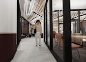 Thumbnail 16 of 30 - A person is standing in a hallway with a red wall on the left side.