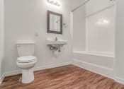 Thumbnail 3 of 10 - a bathroom with a toilet sink and bathtub