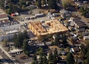 Thumbnail 7 of 38 - A construction site is in the middle of a residential area.