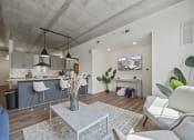 Thumbnail 62 of 76 - a living room with white walls and hardwood floors at The Icon, Richmond, VA 23230