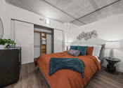 Thumbnail 71 of 76 - a bedroom with a bed and a nightstand  at The Icon, Richmond, VA 23230