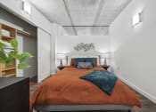 Thumbnail 60 of 76 - a bedroom with a bed and a closet at The Icon, Richmond, VA 23230