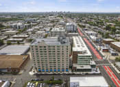 Thumbnail 34 of 76 - an aerial view of a city with a red train in the middle of the street at The Icon, Richmond, VA 23230
