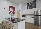 Thumbnail 67 of 76 - a kitchen with a countertop and a refrigerator  at The Icon, Richmond, VA 23230